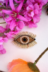 Broche œil doré