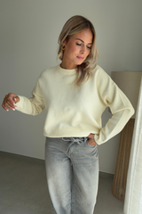 Pull beige dos nu