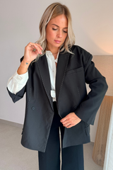Blazer noir à surpiqûres blanche