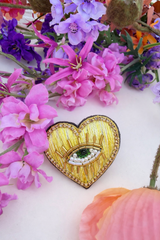 Broche cœur œil doré