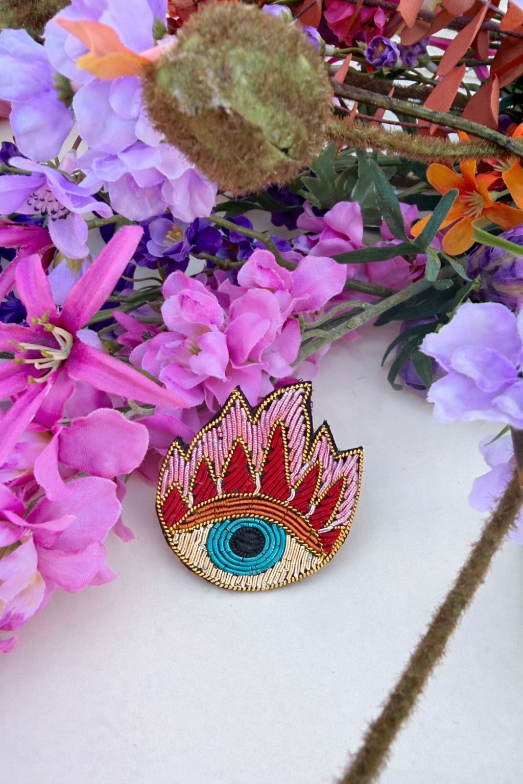 Broche œil & flamme